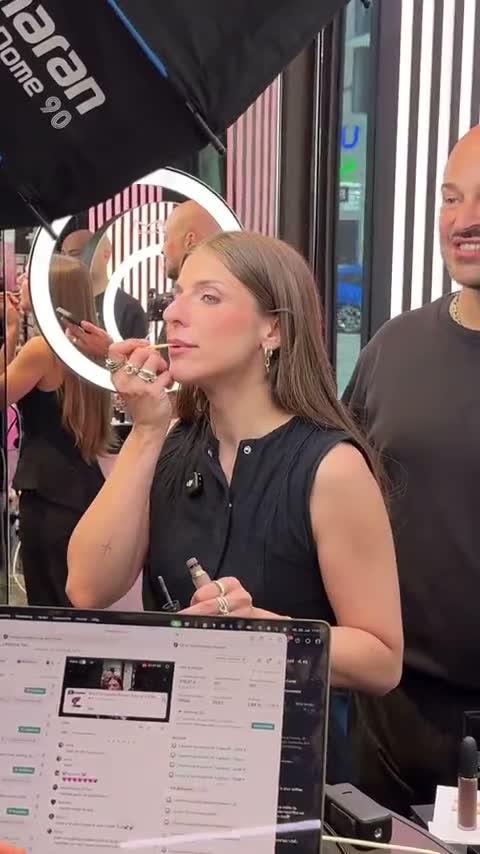 Host at the MAC counter in ring light